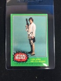 1977 Topps Star Wars Series 4 Card #255 Luke Poses with His Weapon
