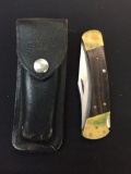 Vintage Buck 110 Folding Pocket Knife in Leather Sheath