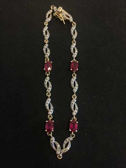 Oval Faceted Ruby Two-Tone Sterling Silver 7" Link Bracelet