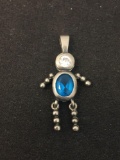 Oval Faceted Blue Topaz w/ Round White Topaz Accent Dancing Child Motif Sterling Silver Pendant