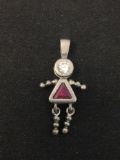 Trillion Faceted Created Ruby w/ Round White Topaz Accent Dancing Child Motif Sterling Silver