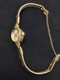 Bulova Designed Oval 13x10mm Bezel 10kt Rolled Gold Vintage Watch w/ Bracelet & Stainless Steel Back