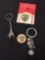 Lot of Four Alloy Items, Two Keychains, Seattle Token & Irish Wall Decal