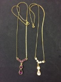 Lot of Two Gold-Tone Alloy Faceted Zircon Accented Drop Necklaces, One w/ White Zircon & Purple