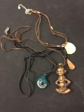 Lot of Four Various Length & Styled Tribal Motif Pendants Leather Cord Necklaces