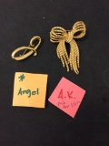 Lot of Two Gold-Tone Alloy Designer Ribbon Motif Brooches, One Ann Klein Designed & Angel Designed