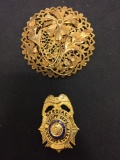 Lot of Two Gold-Tone Alloy Brooches, One Round Floral Motif & One NY Sheriff Department