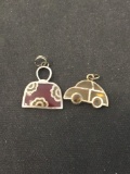 Lot of Two Clear Resin Filled Sterling Silver Pendant, One Automobile Motif & Hand Purse