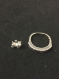 Lot of Two Sterling Silver Items, One Channel Set Amethyst Ring Band & Miniature Terrier Charm