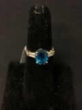 Oval Faceted 9x7mm Blue Topaz Center w/ Tapered Baguette Sides Sterling Silver Ring Band-Size 5
