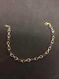 Oval Faceted 5x3mm Amethyst w/ Round Diamond Accent Infinity Design Gold-Tone Sterling Silver 8in