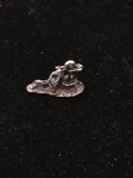 Man in Sombrero Leaning Against Well Sterling Silver Charm Pendant