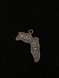 Florida State Outline with Words Miami Beach on It Sterling Silver Charm Pendant