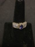 Oval Faceted 7x5mm Tanzanite Center w/ Tanzanite Accents Halo Style 10mm Wide Sterling Silver Ring