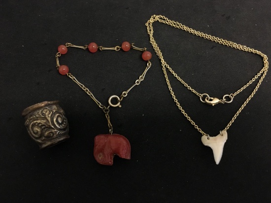 Lot of Two Alloy Jewelry Items, One 20in Long Shark Tooth Necklace & 8in Long Resin Elephant