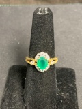 Oval Faceted 8x6mm Created Emerald Center Detailed Gold-Tone Signed Designer Sterling Silver Ring