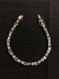 Oval Faceted 6x4mm Blue Topaz w/ Round Faceted CZ Accents 4.5mm Wide 8in Long Infinity Link Sterling
