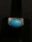 Horizontal Set Oval 17x12mm Polished Turquoise Cabochon Center w/ Pear Blue Topaz Accents Floral