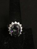 Oval Faceted 15x12mm Mystic Topaz Center w/ Round CZ Accented Halo High Polished Sterling Silver