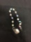 Round 5.5mm Multi-Colored Cat's Eye Beaded 7in Long Sterling Silver Heart Tag Toggle Bracelet