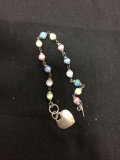Round 5.5mm Multi-Colored Cat's Eye Beaded 7in Long Sterling Silver Heart Tag Toggle Bracelet