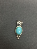 Oval 8x5mm Turquoise Cabochon Center 20mm Long Detailed Sterling Silver Pendant