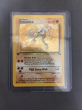 Fossil 1st Edition Rare Pokemon Holo Trading Card - Hitmonlee 7/62