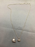 Lot of Two Sterling Silver Items, One 13x10x8mm Football Helmet Pendant & 10x6mm Football Pendant w/