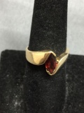 Semi-Bezel Set Marquise Faceted 10x5mm Garnet Center 11mm Wide Tapered Bypass 14Kt Gold Signed