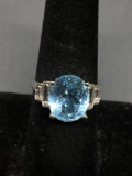 Oval Faceted 12x10mm Blue Topaz Center w/ Four Baguette Faceted CZ Sides High Polished Sterling