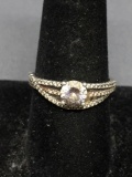 Round Faceted 5.5mm CZ Center w/ Round CZ Accented Criss-Cross Ribbon Design Sterling Silver Ring