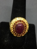 Oval 12x9mm Ruby Cabochon Center w/ Round Garnet Accented Halo Filigree Decorated Gold-Tone Sterling