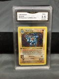 GMA Graded 1999 Pokemon Base Set 1st Edition Shadowless #8 MACHAMP Holofoil Rare Trading Card - VG+