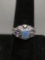 Oval Faceted 7x5mm Blue Gem Center w/ Six Marquise Faceted Tanzanite Sides Sterling Silver Ring Band