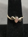 Sawtooth Bezel Set Oval Pink Mother of Pearl Center w/ Side Swirl Accents Sterling Silver Ring Band