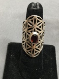 Bezel Set Oval Faceted 8x6mm Garnet Center Geometric Patterned Halo 35mm Long High Polished Sterling