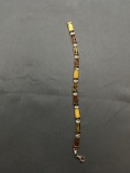 Ten 10x5mm Barrell Multi-Colored Amber Cabochon Featured 8in Long Sterling Silver Tennis Bracelet