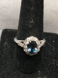 Oval Faceted 9x7mm London Blue Topaz Center w/ Round Faceted CZ Accented Scallop Halo & Shoulders