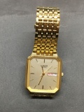 Citizen Designer Rectangular 27x35mm Serial 693238 Gold-Tone Date Feature Water Resistant Stainless