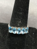 Five Prong Set Oval Faceted 5.5x3.5 mm Blue Topaz Featured Sterling Silver Anniversary Band