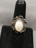 Oval 13x10mm Mother of Pearl Cabochon Center w/ Scallop & Rope Detailed Halo Split Shank Sterling