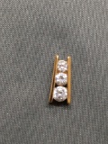 Three Graduating Round Faceted CZ Centers from 3mm to 4mm in Diameter Channel Set Gold-Tone Sterling