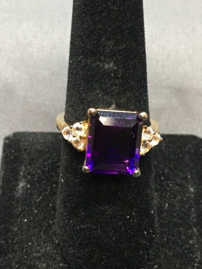 Emerald Cut Faceted 12x10mm Purple CZ Center w/ Triplet Round CZ Accents Gold-Tone Sterling Silver
