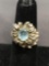 Oval Faceted 7x6mm Blue Topaz Center Rustic Sunflower Motif 10Kt White Gold Ring Band - 6 Grams