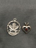 Lot of Two Sterling Silver Pendants, One Petite Heart w/ Red Gemstone Center & Winnipeg Maple Leaf