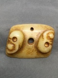 Hand-Carved Twin Inverted Skull Design 3.25in Long 2.5in Tall Rectangular Orange Jade Pendant