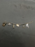 Curb Link 5mm Wide 7in Long Sterling Silver Bracelet w/ Six Charms