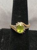 Oval Faceted 8x6mm Peridot Center w/ Round Faceted Diamond Accents Bypass Sterling Silver & 10Kt