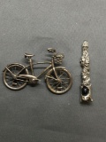 Lot of Two Silver-Tone Items, One 2.5in Wide 2in Tall Bicycle & One 2.5in Long Skull Themed Pendulum