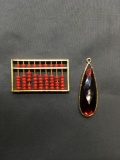 Lot of Two Gold-Tone Fashion Pendants, One Abacus Style & One w/ Faux Red Gemstone Center